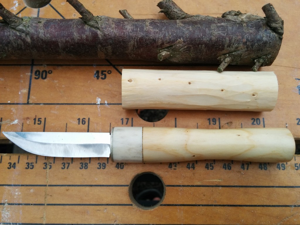 Finished knife, handle blank and raw conifer